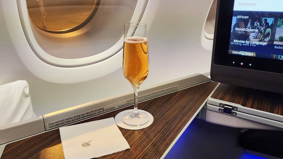 Beginning the flight with a welcome glass of Champagne.