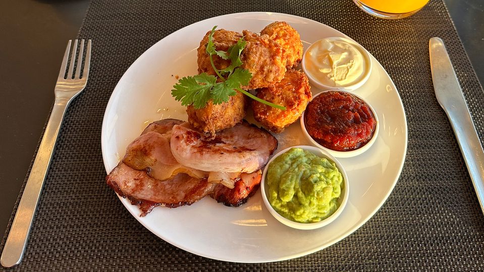Corn fritters are a staple of the lounge; served with chilli jam, sour cream and guacamole.