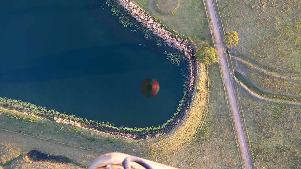 Our reflection in one of countless dams far below.