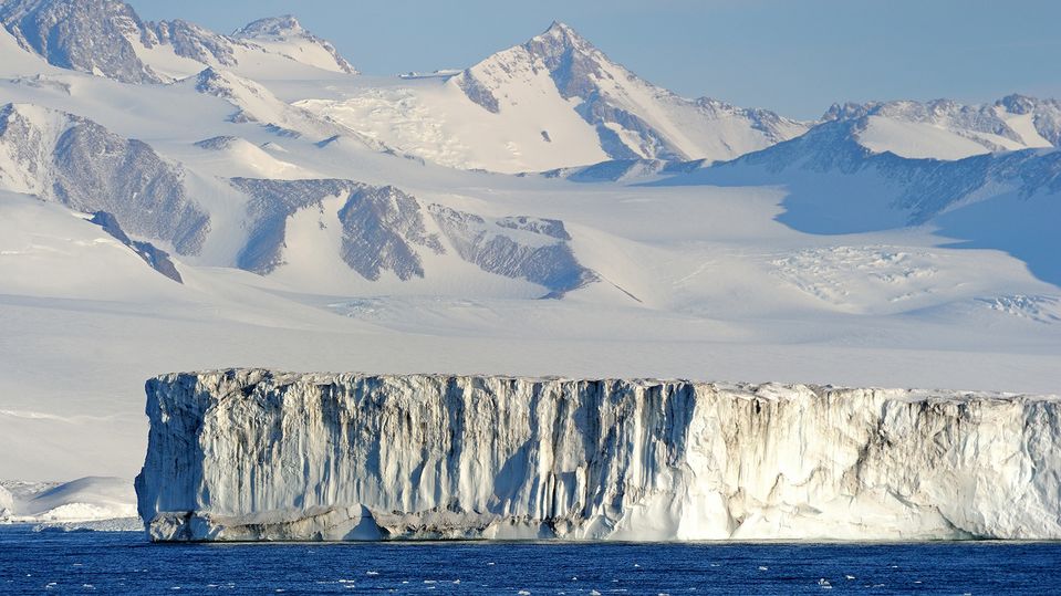 Feel dwarfed by towering Ross Ice Shelf, the largest ice shelf of Antarctica.