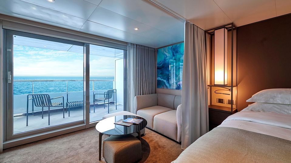 Breathe in the view from your chic verandah suite.