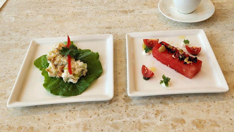 Smoked chicken lettuce cups with cous cous, and watermelon with olives and walnuts.