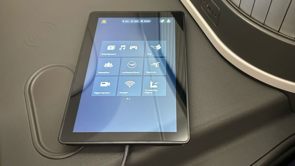 This large and surprisingly heavy tablet is docked into the side of each Allegris seat.