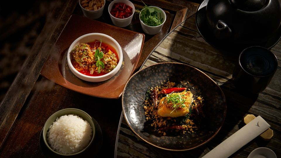 Hand-wrapped Sichuan pork dumplings with chilli sauce, and crispy black cod with golden garlic and chilli.