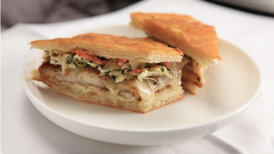 Comfort food above the clouds: Qantas' toasted chicken schnitzel sandwich remains a top choice in business class.