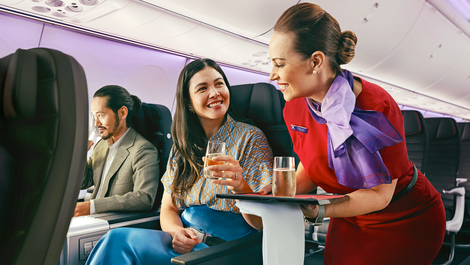 Business class passengers will earn one status credit for every $12 to $24 they spend.
