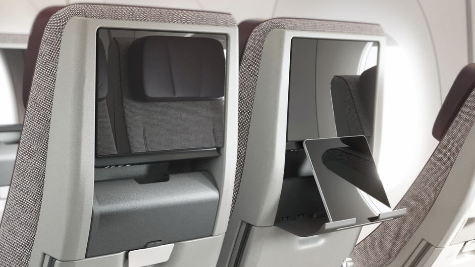 Qantas' new economy seats also feature a 'device holder' stand for tablets and phones.