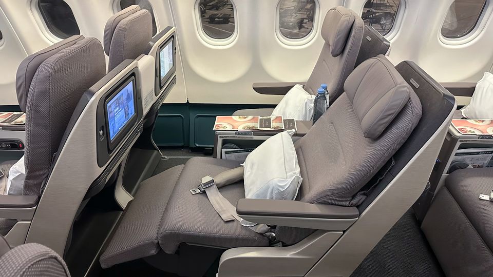 Cathay's A330 regional business class seat reclines into its own fixed shell.