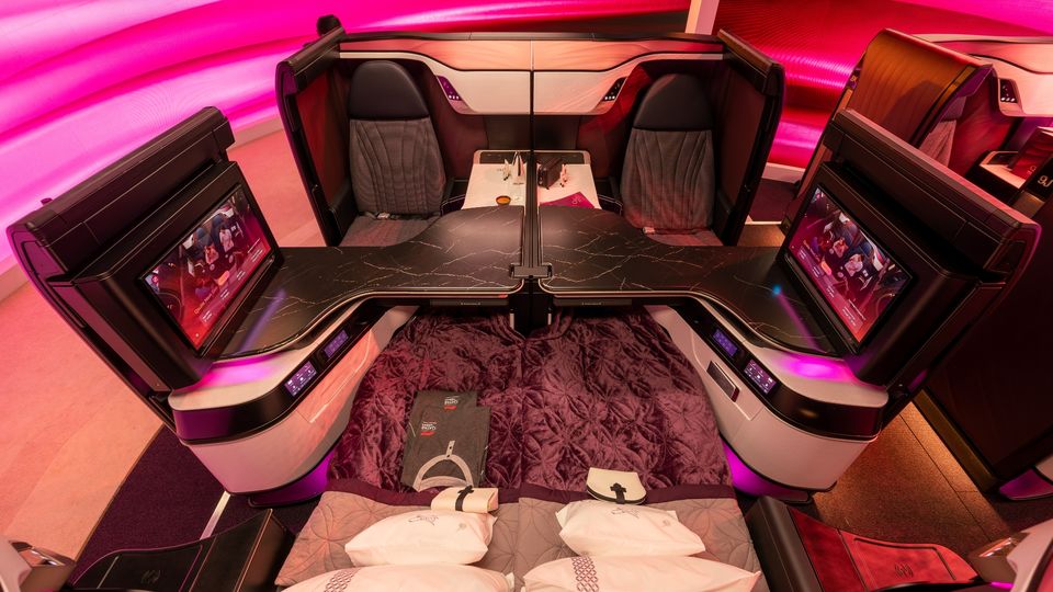 Qatar Airways' QSuite Next Gen packs large OLED screens (which, as shown here, can also be pivoted out of the way).