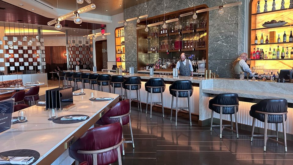 Delta One Lounges offer a full bar service with both complimentary and paid drinks.