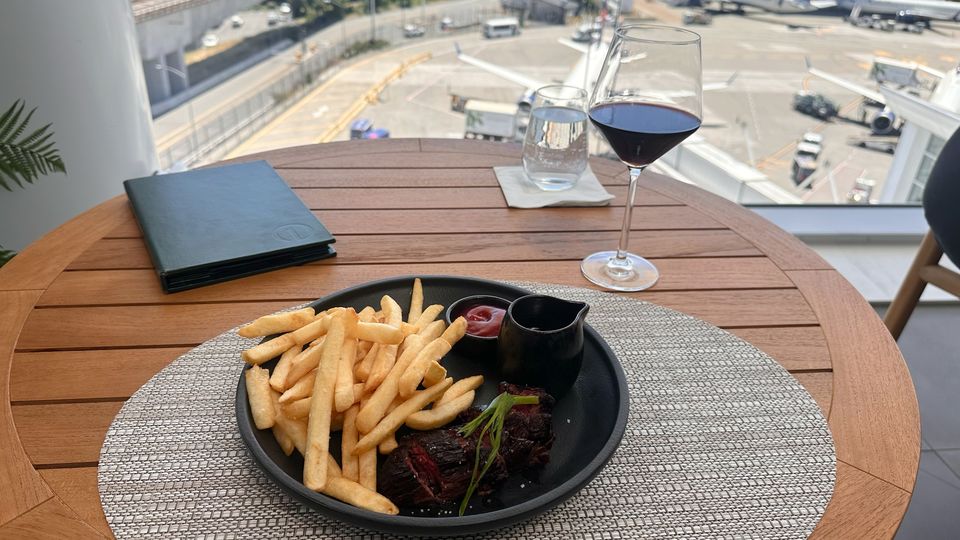 Dry aged hangar steak, and a glass of French Bordeaux.