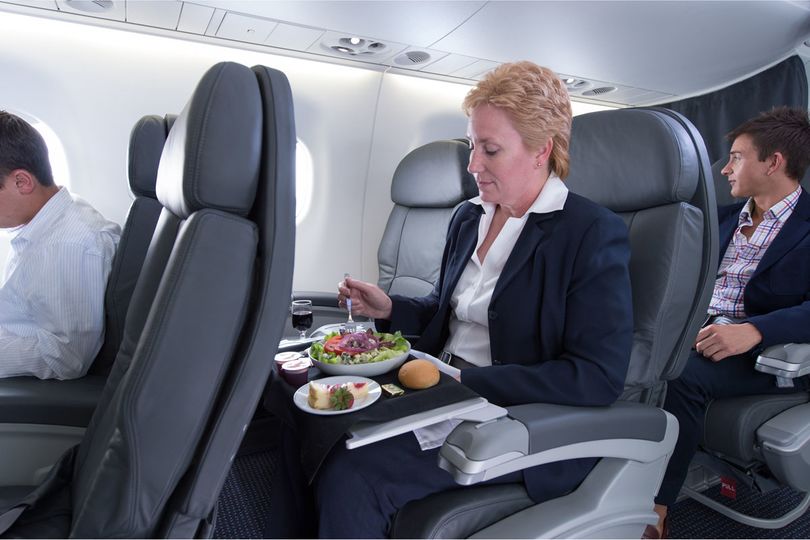 Sit back and relax in first class on AA's Embraer 175 aircraft...