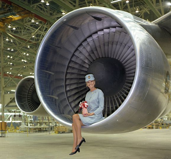 Qantas cabin crew member Pat Tudor sits in the Boeing 747's engine at the factory rollout.