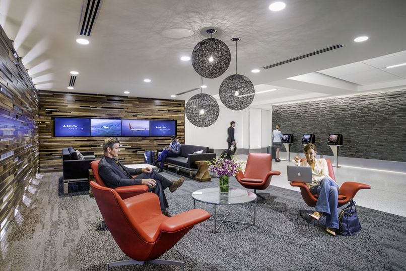 Relax in the exclusive Delta One check-in lounge in Terminal 5...