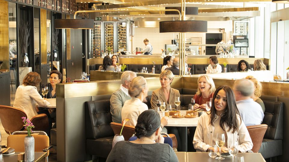 Blue by KLM restaurant in full swing at Amsterdam Schiphol Airport.