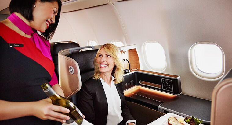 You'd be smiling too if you'd just upgraded to business class..!