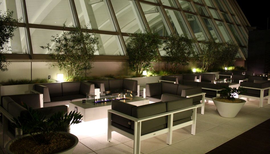 (Look to the left of the small fireplace, with a large waterproof cover...)